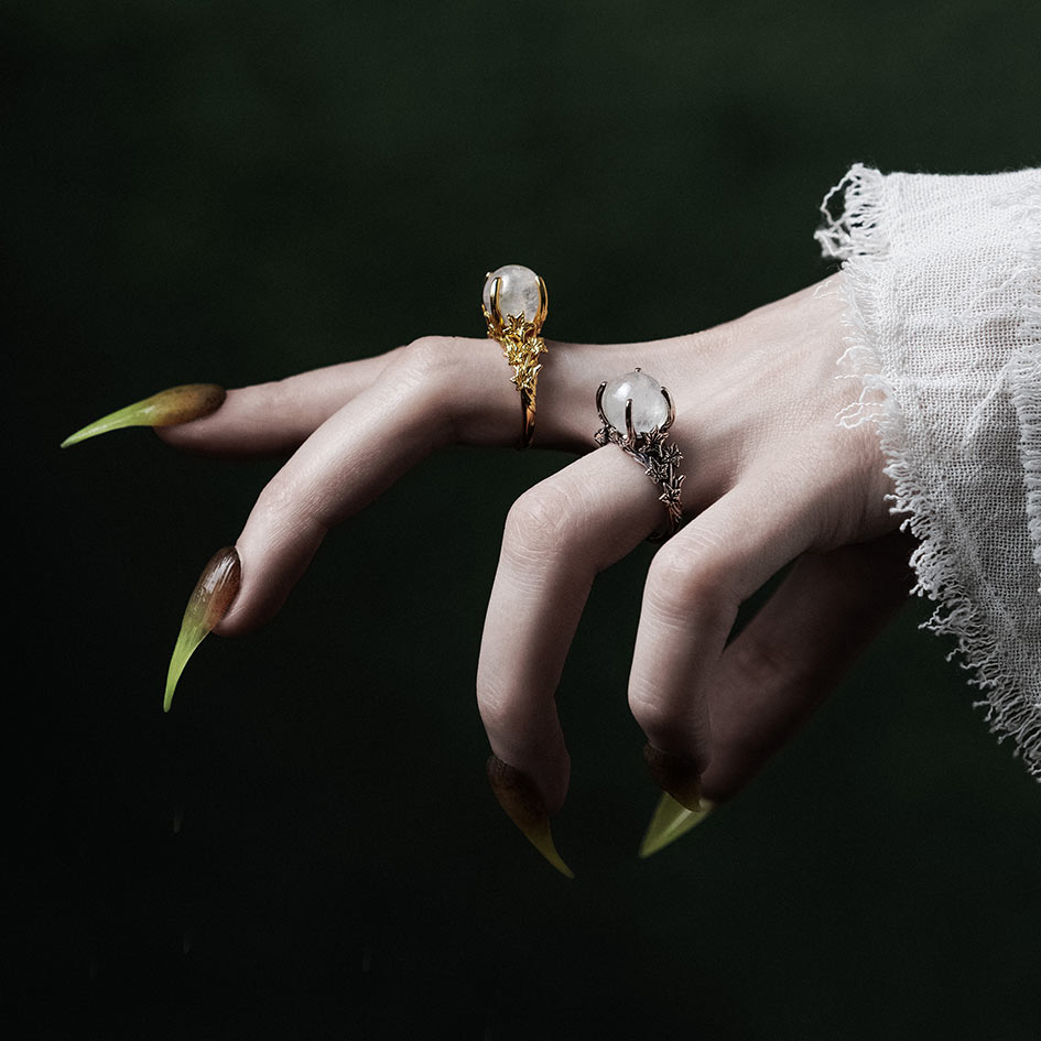 Model wearing crystal ball rings