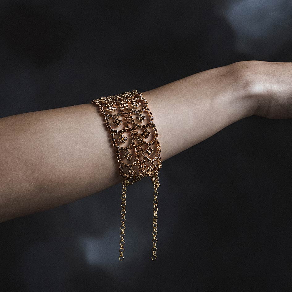 Model wearing Brenna gold plated dazzle chain bracelet on wrist