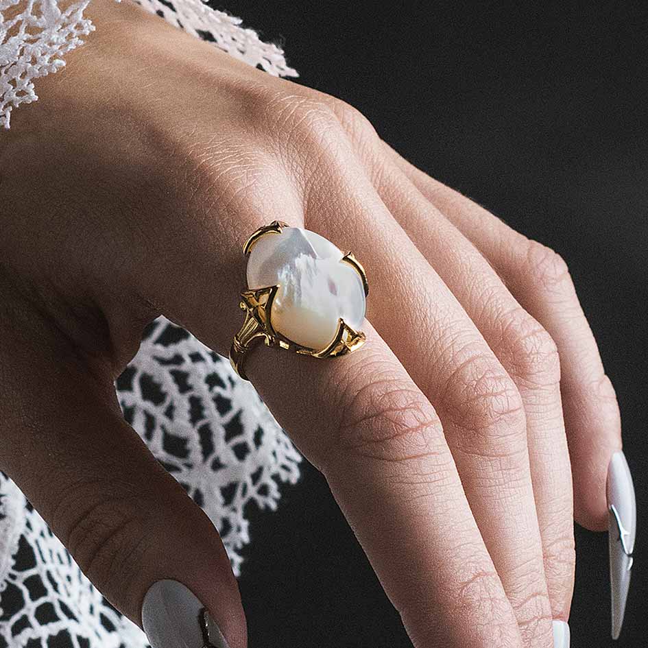 Model wearing Circinus gold gothic pearl ring