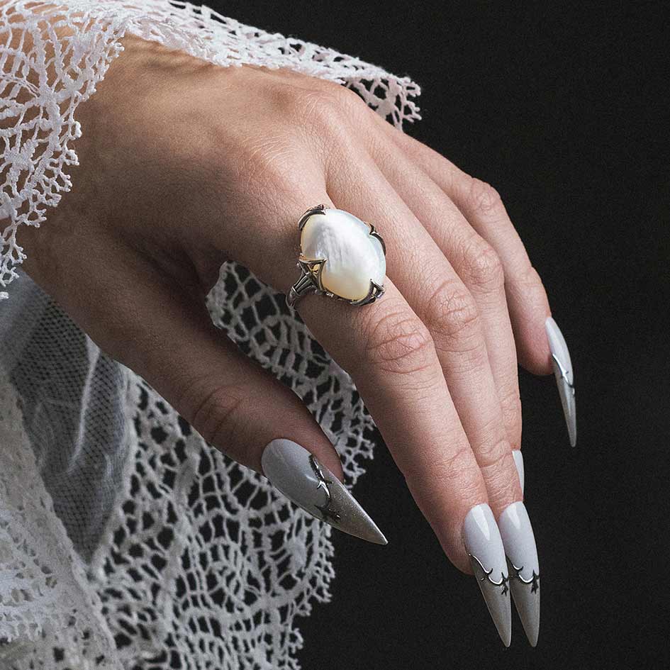 Model wearing Circinus silver gothic pearl ring