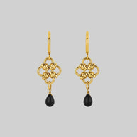 Gold gothic hoop earrings with black stone