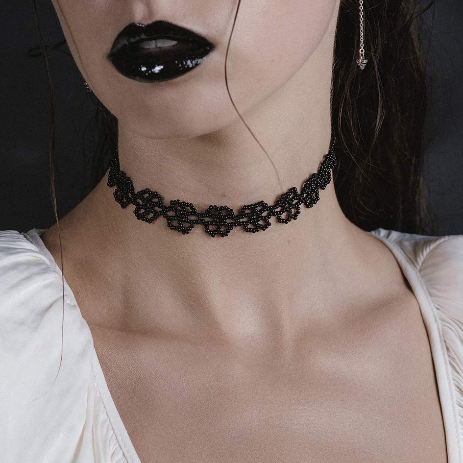 Model wearing Ermery black beaded floral choker