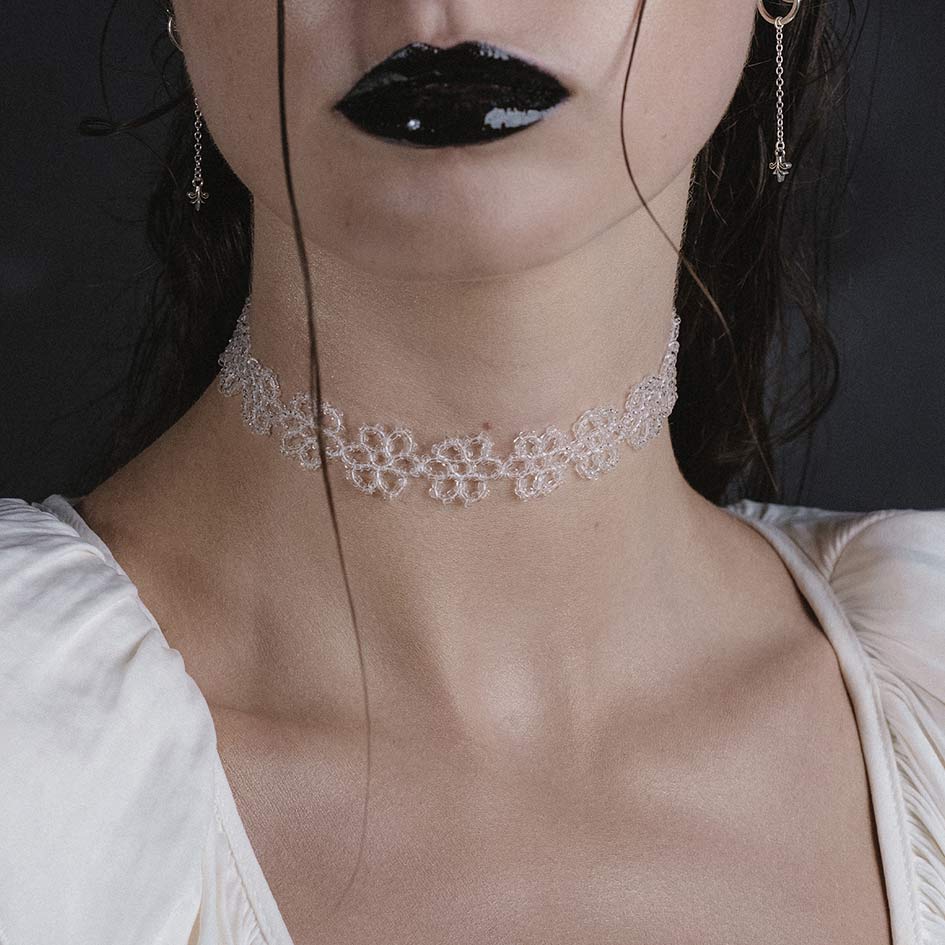 Model wearing Ermery white beaded floral choker