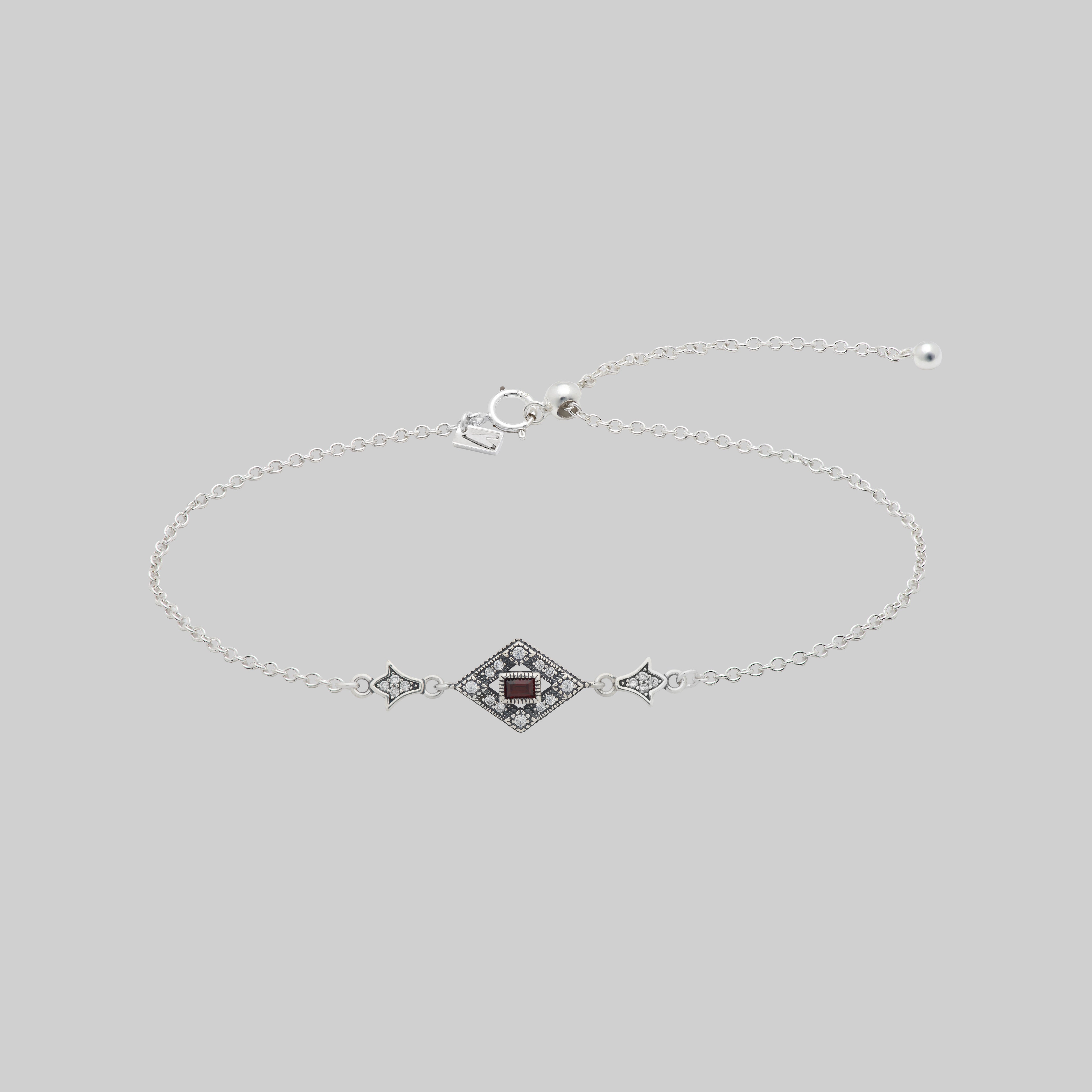 Silver dainty bracelet with garnet gemstone in a decorative 20s style