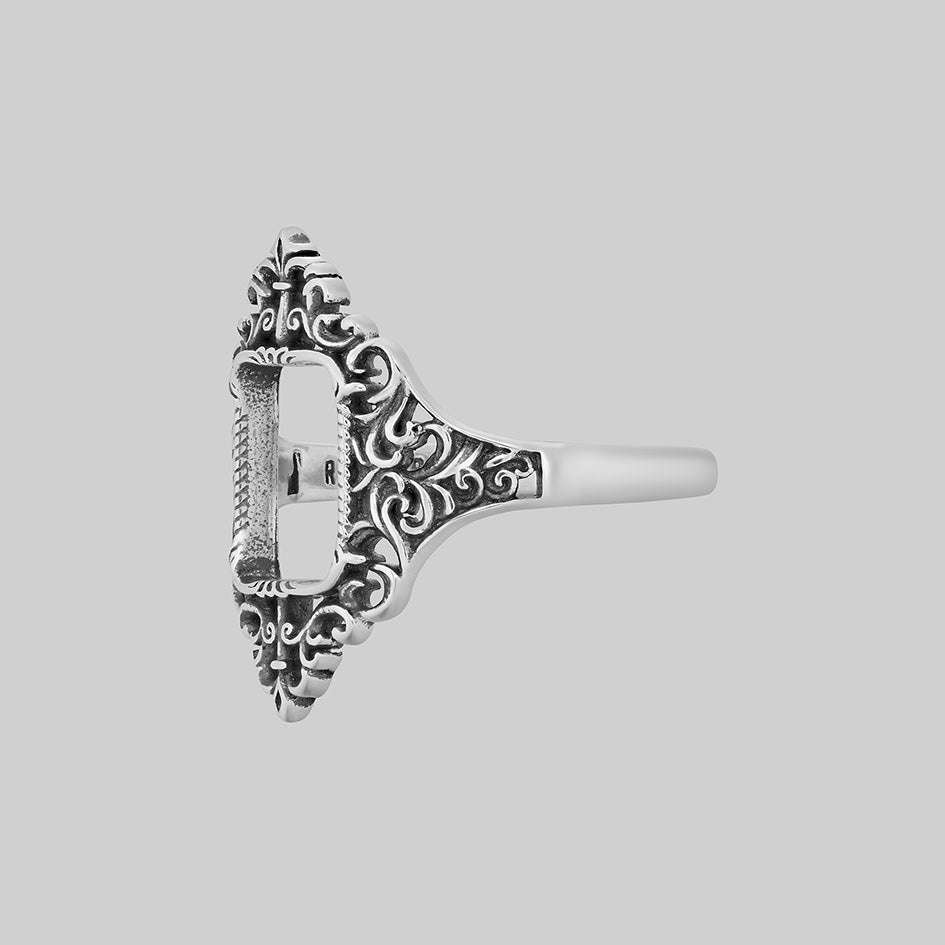 Silver ornate frame ring, side view