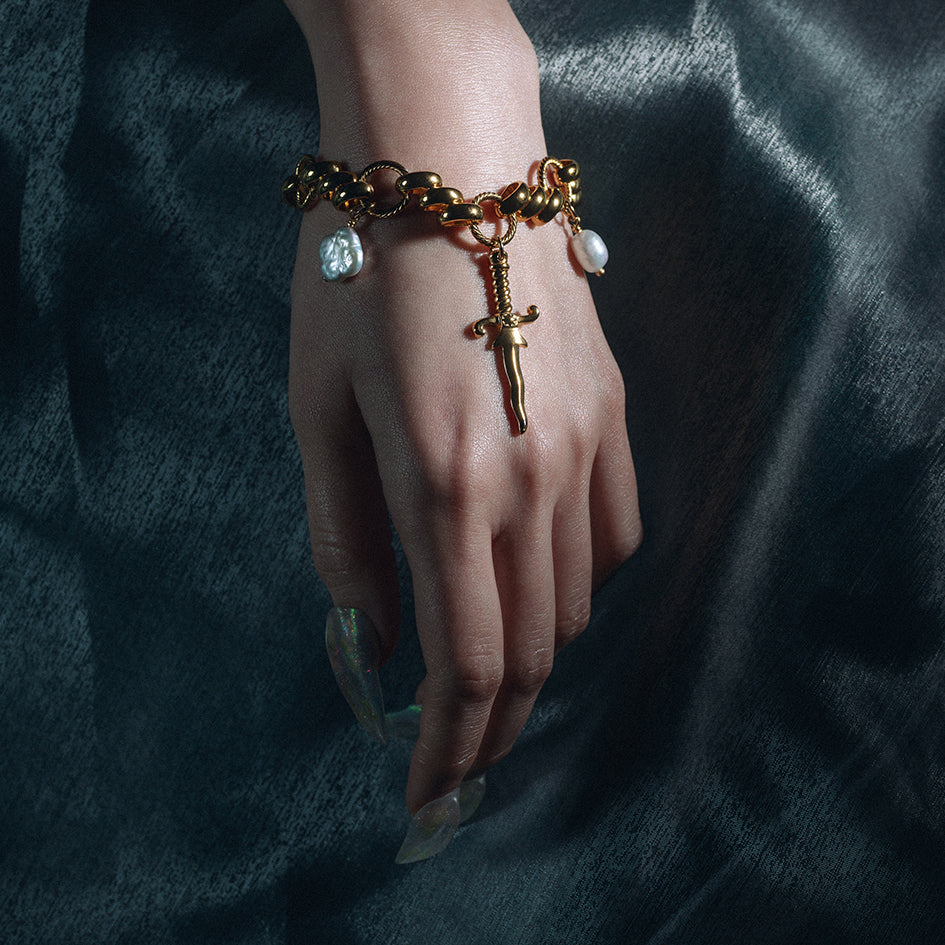 dagger pearl quatrefoil charm gothic bracelet gold twisted rope chain