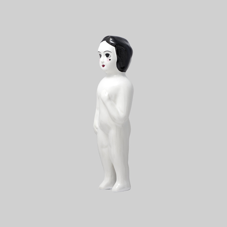 Glossy white ceramic figurine, black hair, hand-painted face
