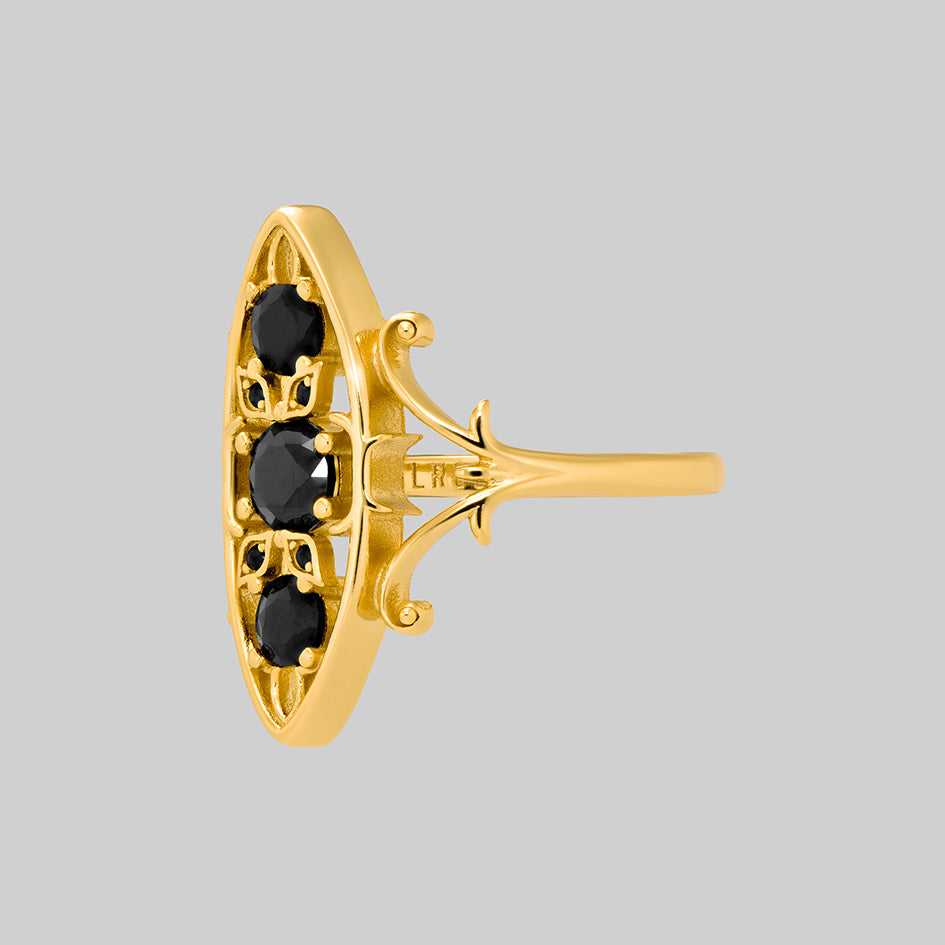 Heloise gold heraldic lily black onyx ring, side view
