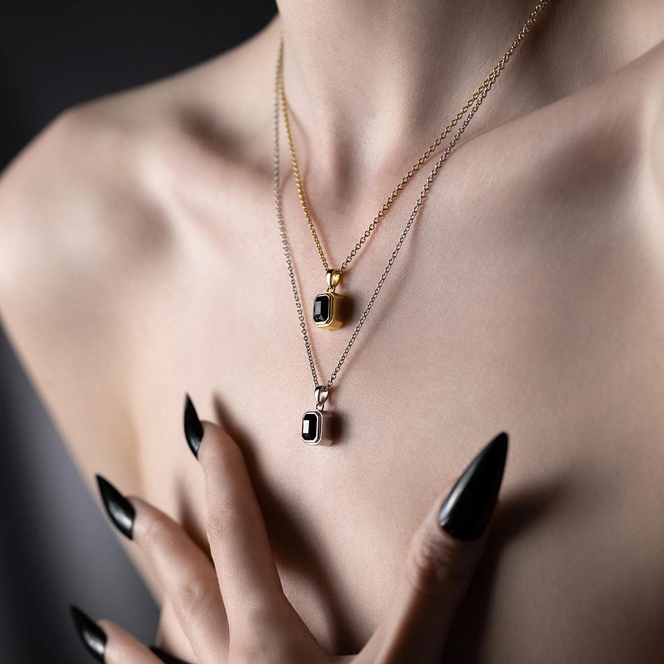 Gold and sterling silver Onyx cremation necklaces layered at two lengths