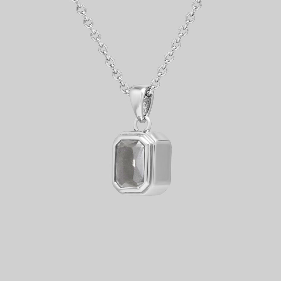 Side view of the sterling silver Clear Quartz cremation pendant showing the bezel setting and pendant depth