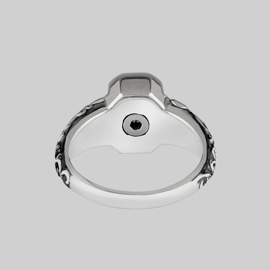 Inside of the sterling silver cremation ring showing the screw fastened ashes chamber beneath the stone