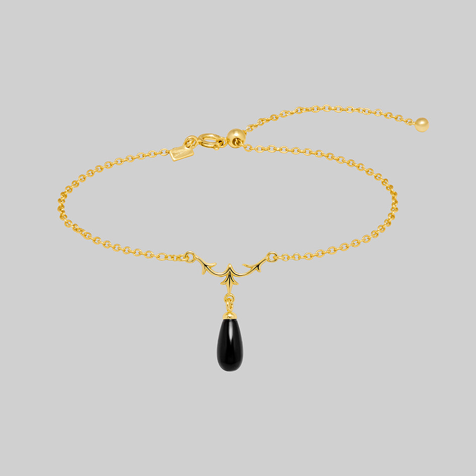 Lisette 18k gold plated silver bracelet with heraldic lily and black glass droplet