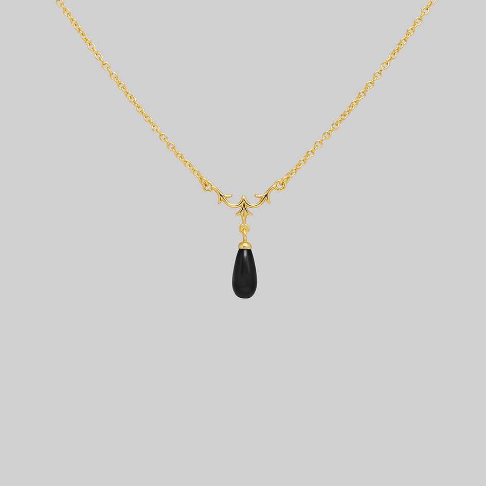 Lisette 18k gold plated silver necklace with heraldic lily and black glass droplet