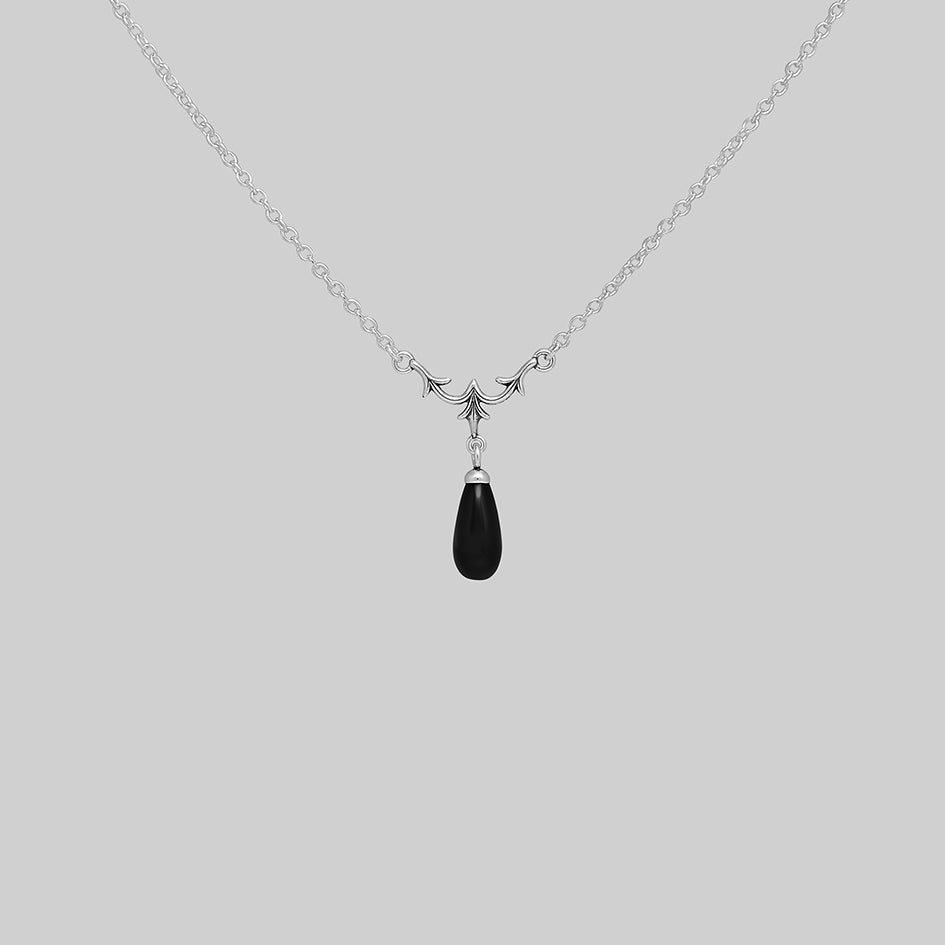 Lisette sterling silver necklace with heraldic lily and black glass droplet