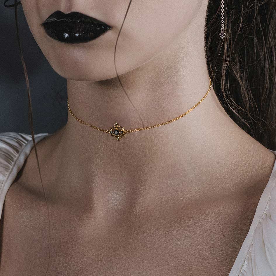 Model wearing Lorin gold black onyx trilogy choker