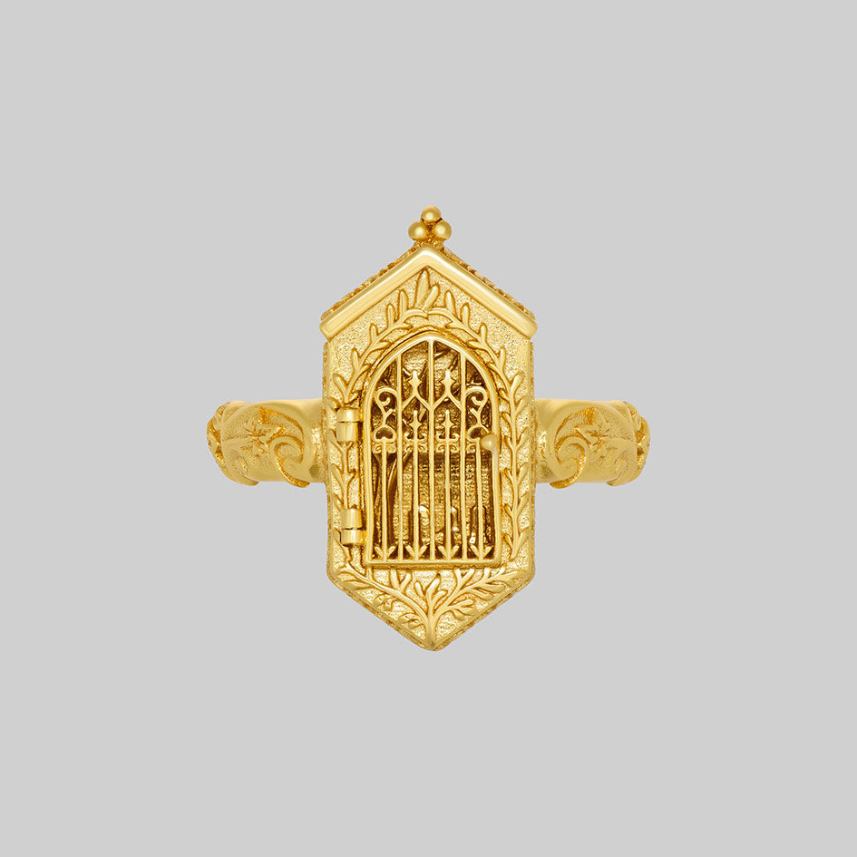 Gold iron gate ring with gate closed, front view