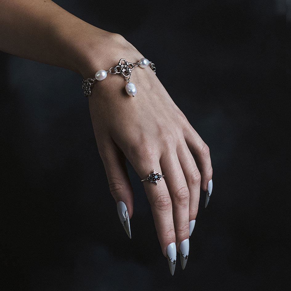 Model wearing Muriel silver chainmail and pearl bracelet