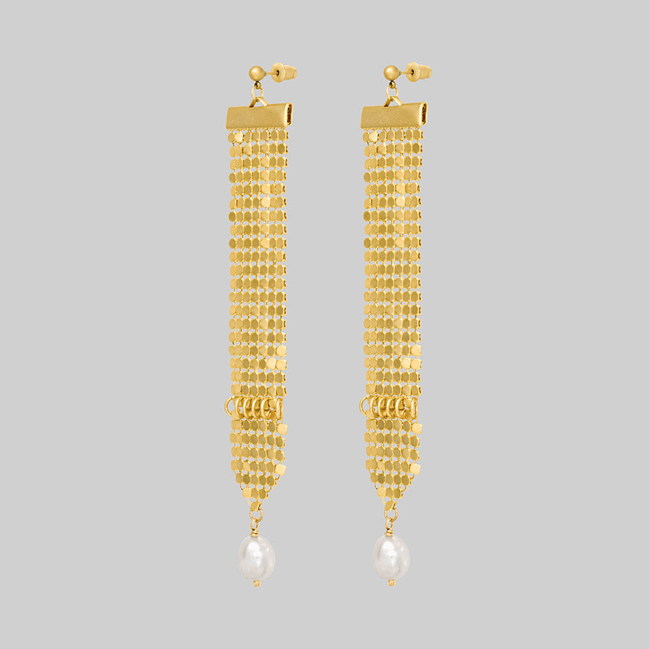 Oda gold armoured pearl drop earrings, side view
