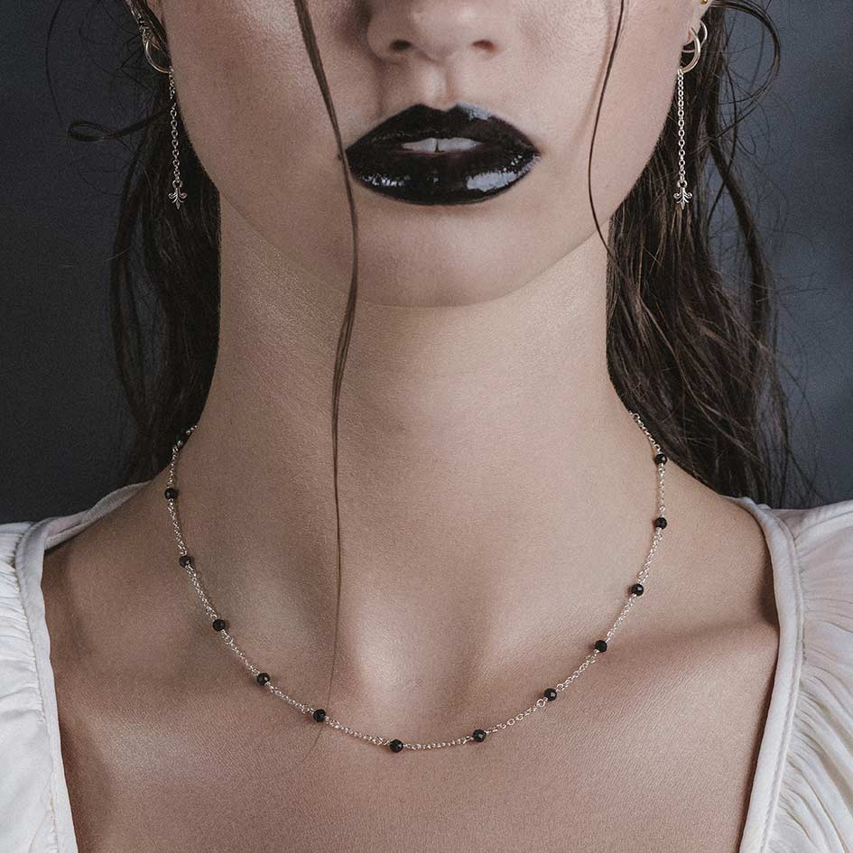 Model wearing Odette silver black spinel bead necklace