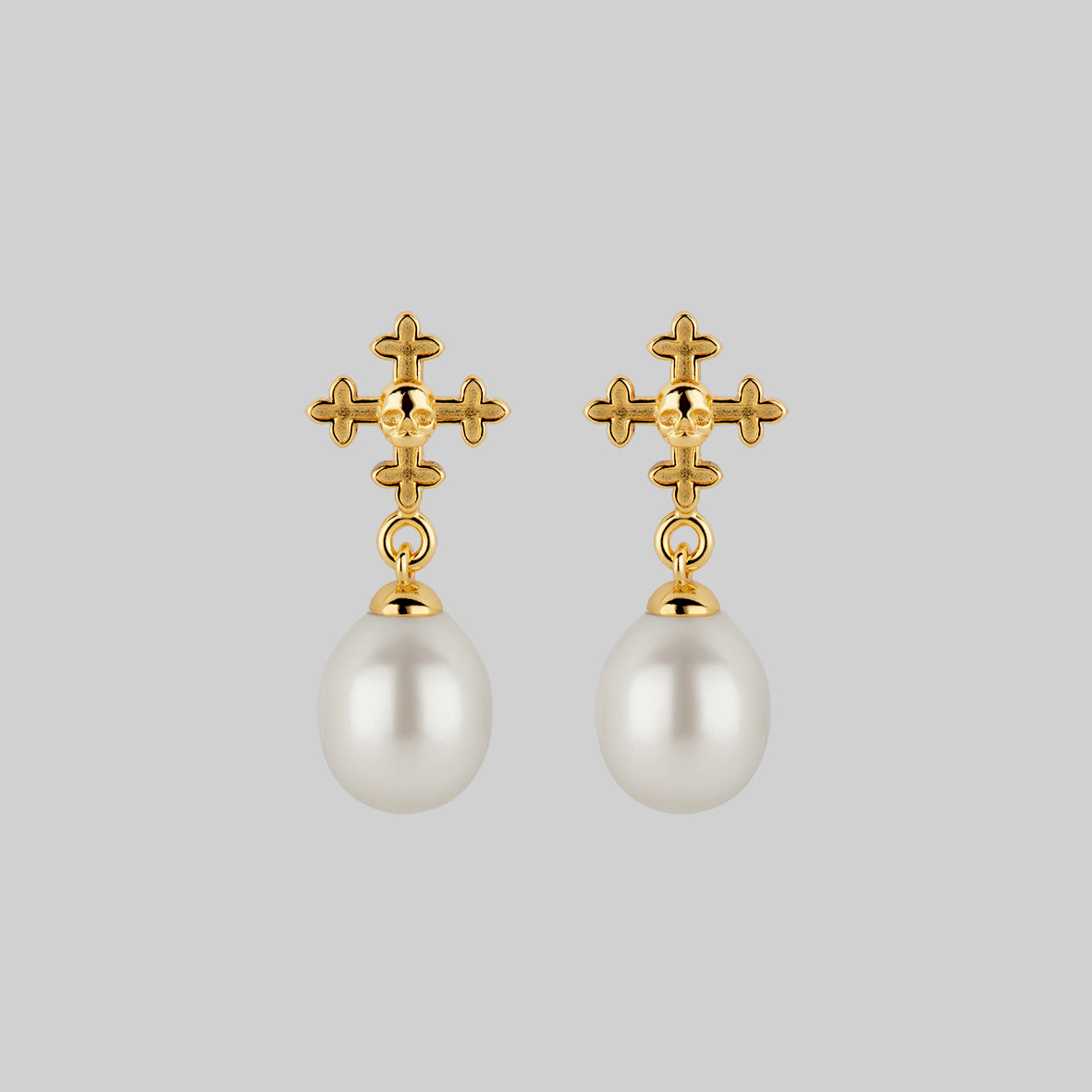dainty pearl and skull stud earrings