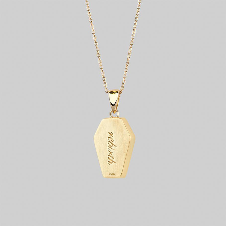 gold plated coffin necklace with 'rebirth' engraved
