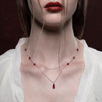 Dainty silver necklace with red drop and beads