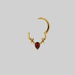 luxurious gold and garnet septum ring helix daith