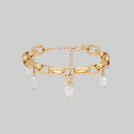Gold link chain bracelet with pearl charms 