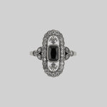 CZ statement ring with black onyx and fleur de lis