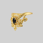 Gothic gold ornate black onyx ring with skulls