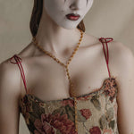 gold twisted knot chain necklace worn on model