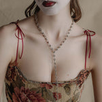 silver unique twisted knot chain worn on model