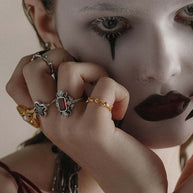 gold and silver detailed gemstone gothic rings