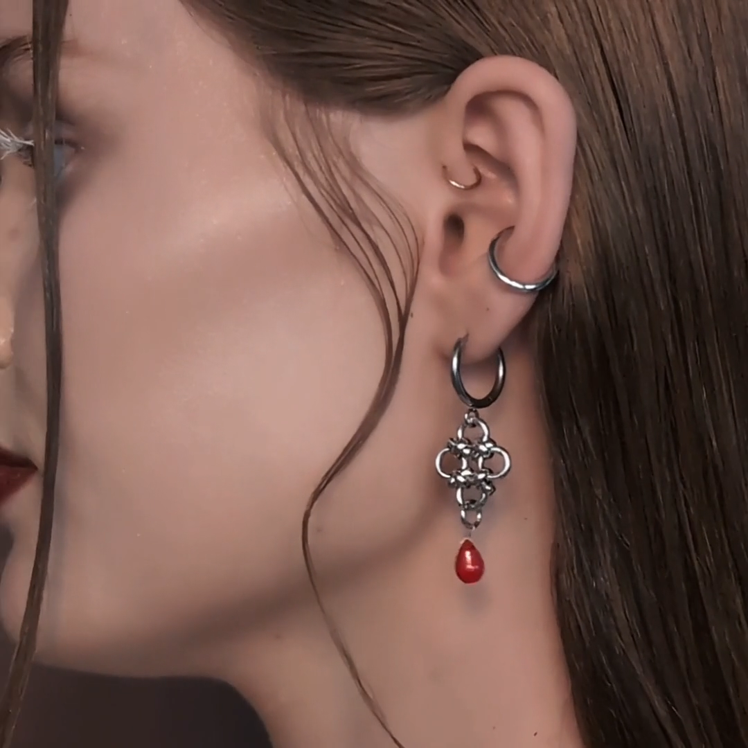 silver chainmail drop earrings with red droplet