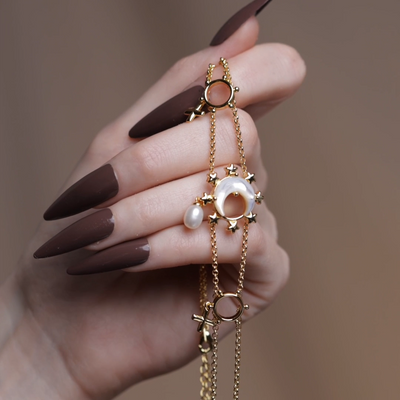 Gold crescent moon pearl detail choker
