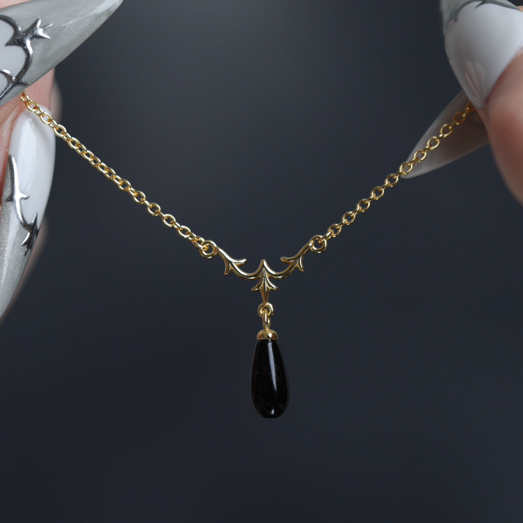 Video of Lisette heraldic lily black glass droplet bracelet