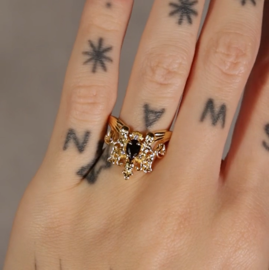 Gothic gold ornate black onyx ring with skulls