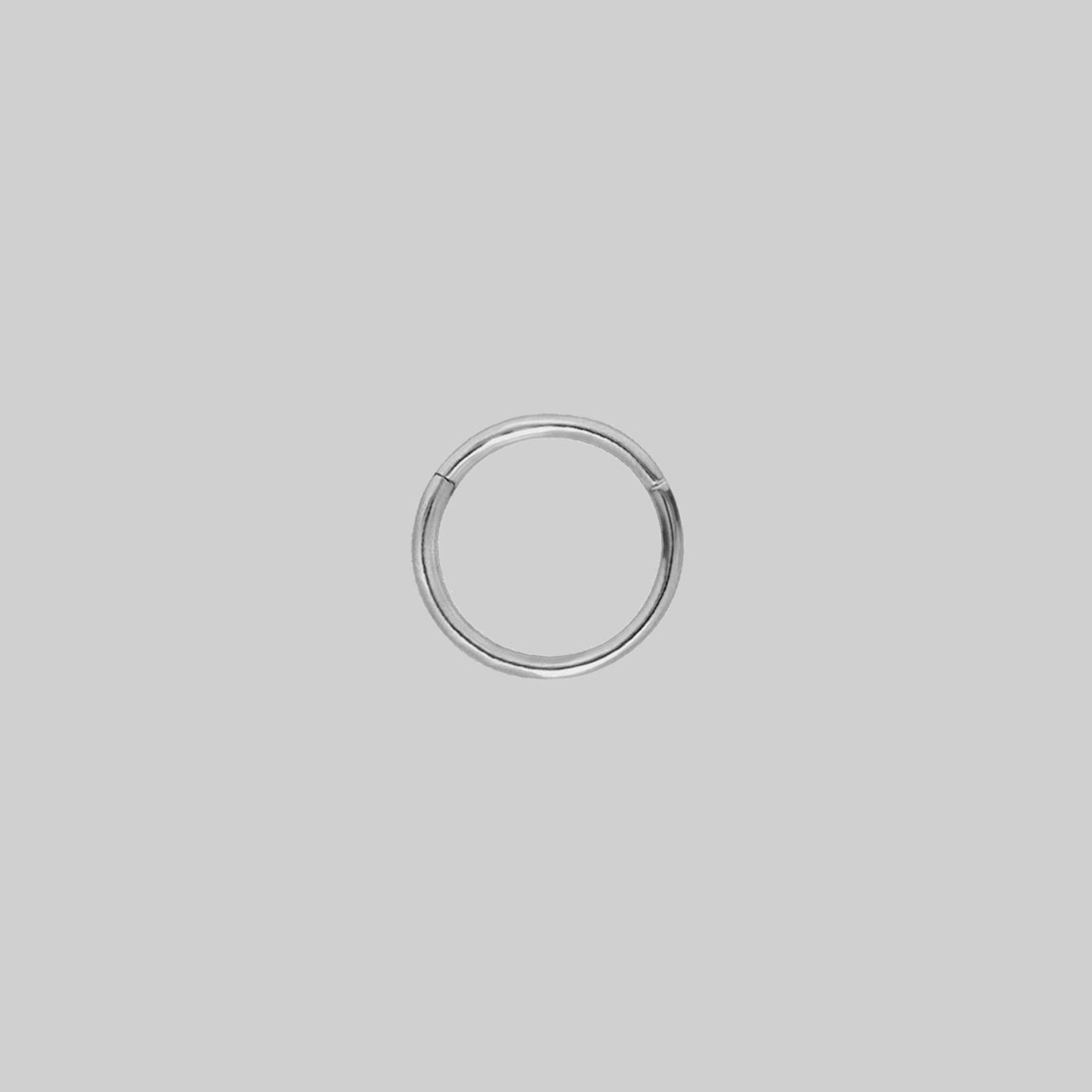 A simple, seamless silver clicker piercing 10mm x 1.2mm