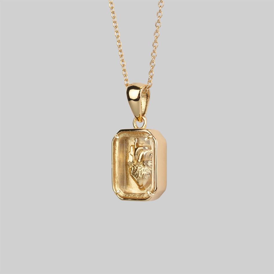 Gold plated 3D anatomical heart under glass necklace side profile