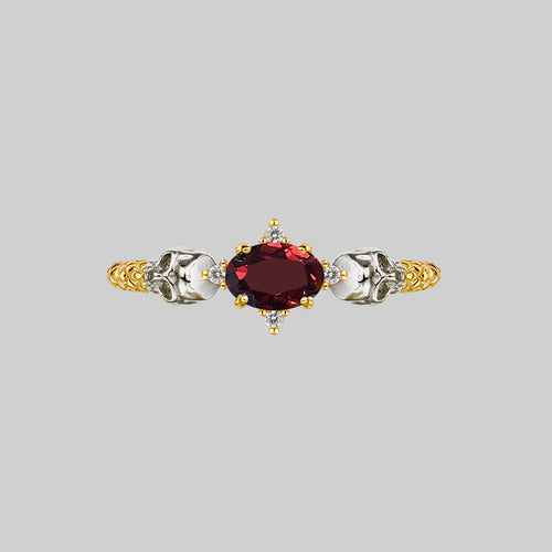 POISON. Garnet & Skulls Ring - Silver