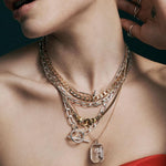 gold interlocking hands necklace