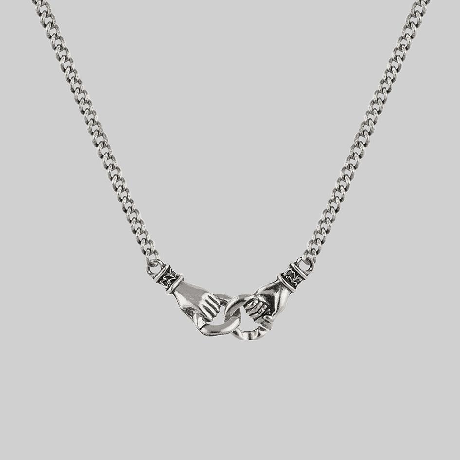 Hands-holding-silver-necklace