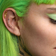 Gold flourish cartilage earrings