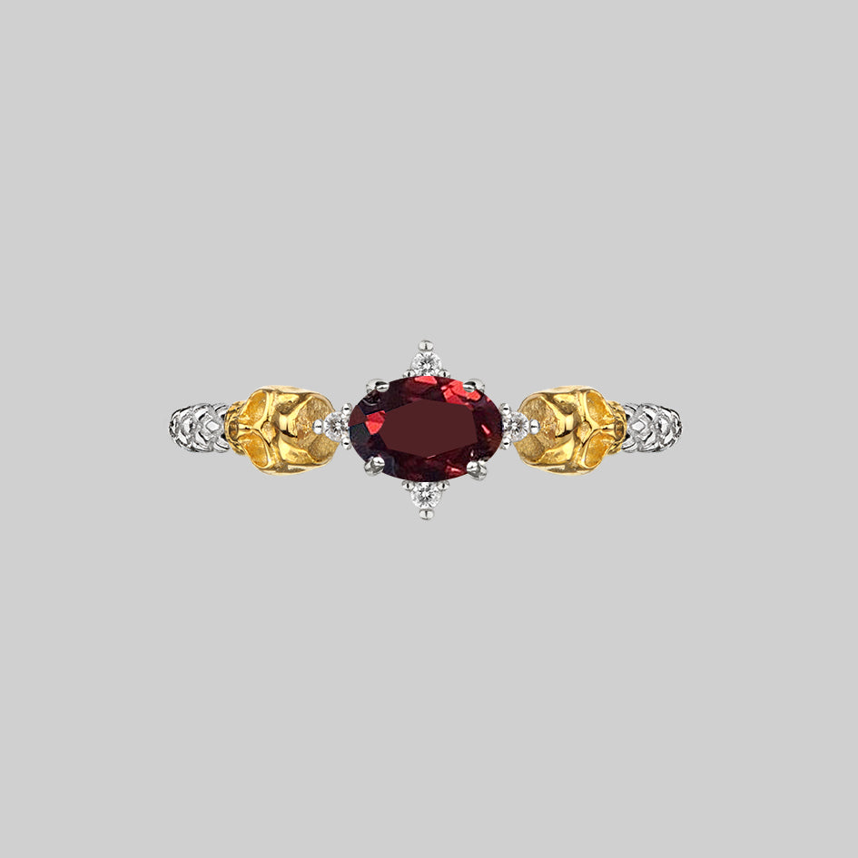 Silver skull garnet ring