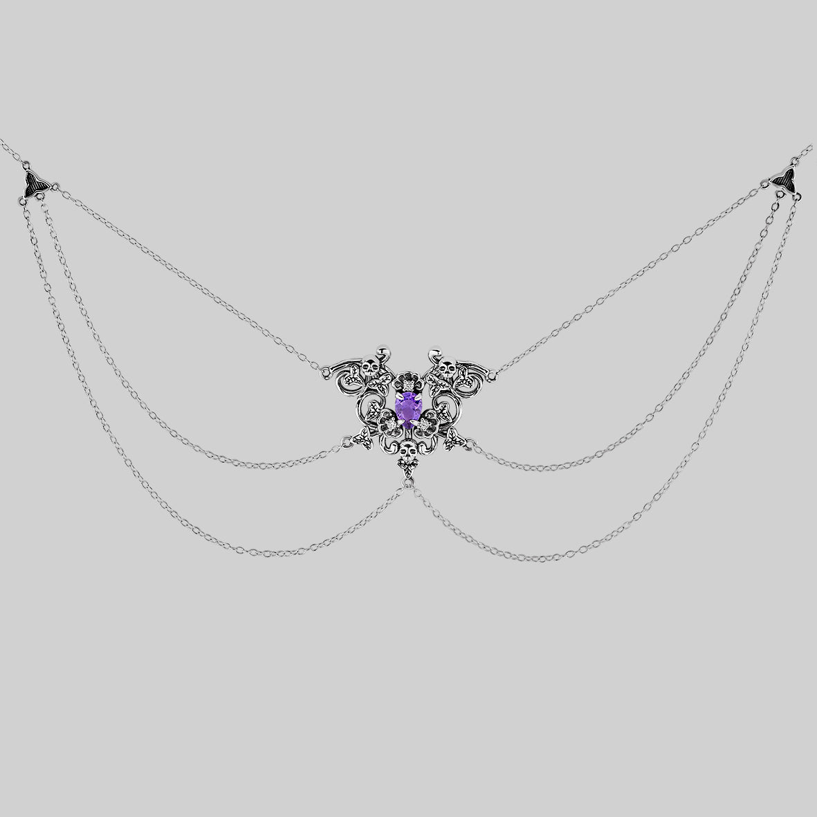 Silver detailed skull and amethyst necklace