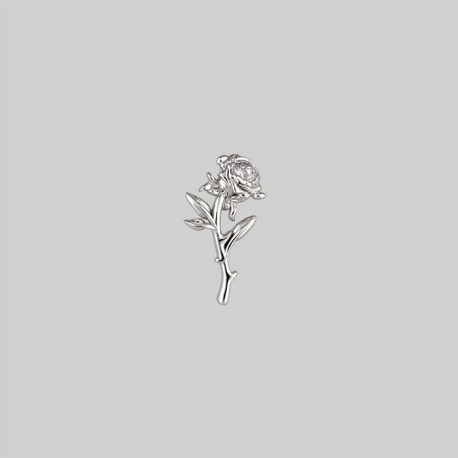 silver rose stem tragus piercing 