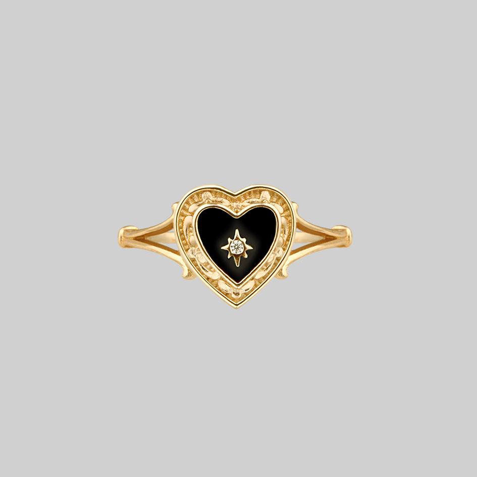 gold ring with black heart 