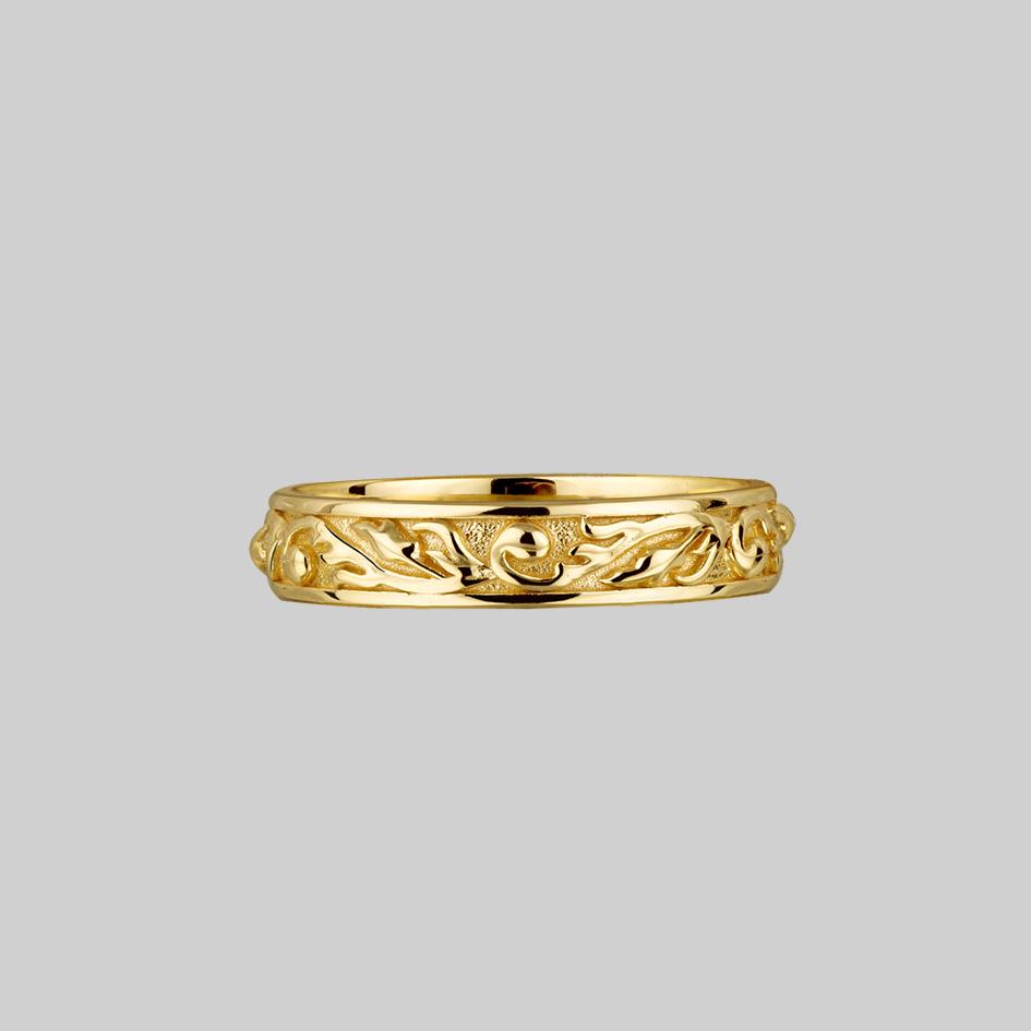 gold ornate band ring