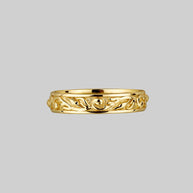 gold ornate band ring