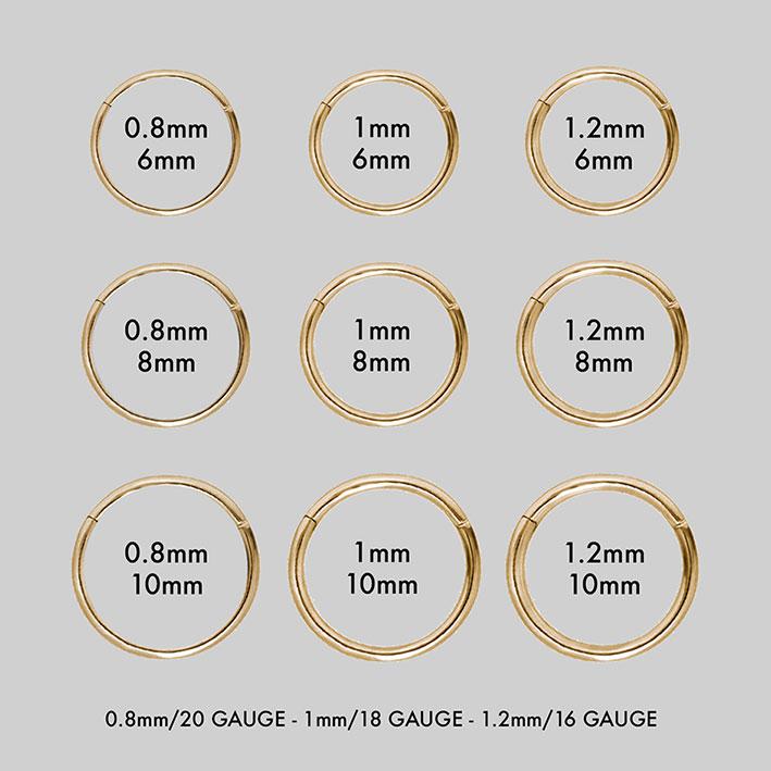 group of gold titanium hoop clicker piercings showcasing the different sizes available
